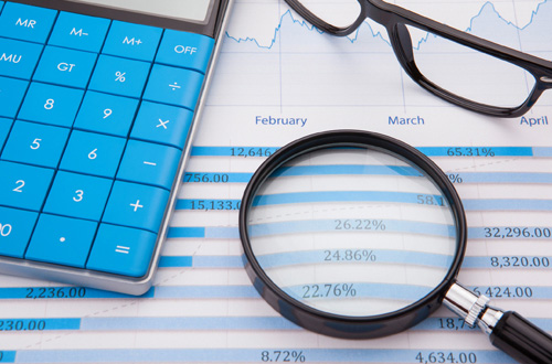 a magnifying glass and a calculator
