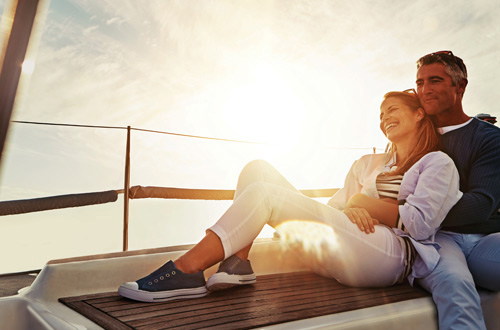 couple snuggling on a boat
