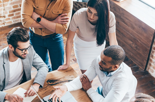 group of people working at a table