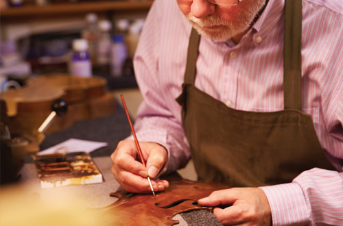 craftsman building a violin