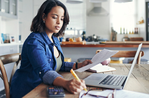 a woman working on a computer 